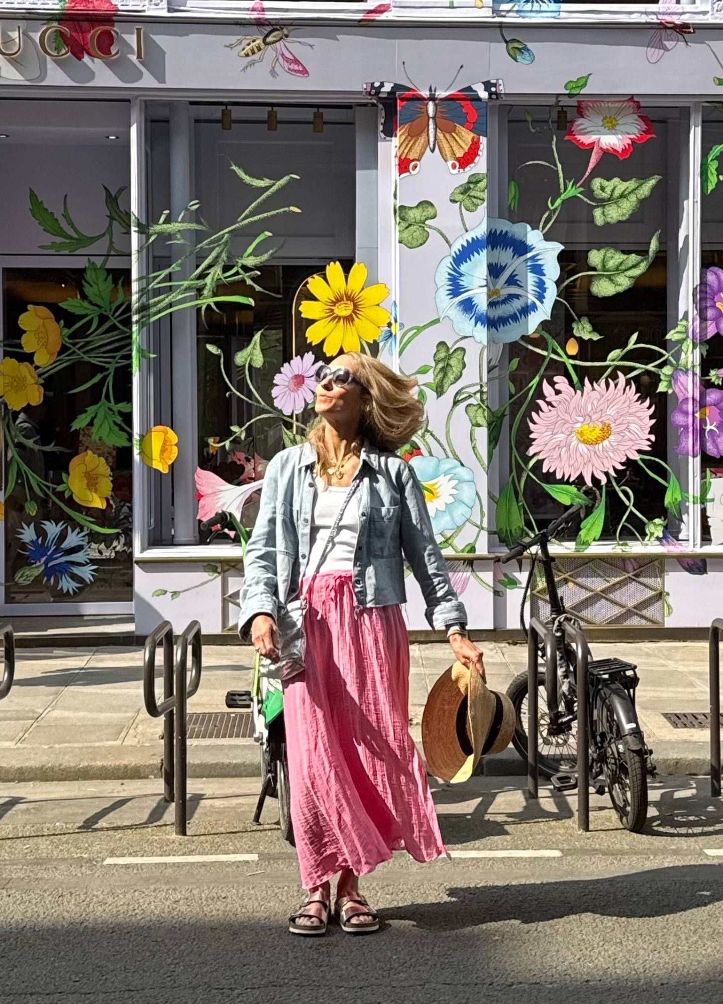 Jaimee outside a floral Gucci storefront